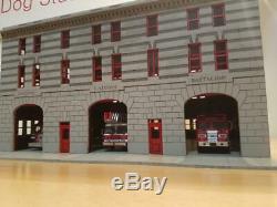 1/64 scale Manhattan Fire station for code 3's. Built and ready as pictured