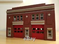 1/64 scale fire station. Fits Code 3's. Built and Ready red brick