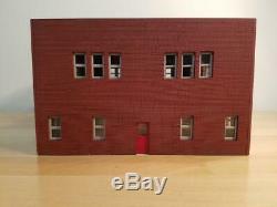1/64 scale fire station. Fits Code 3's. Built and Ready red brick