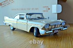 A Danbury mint scale model of a 1958 Plymouth Fury, boxed