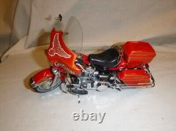 A Franklin mint of a scale model of a Harley Davidson Christmas collection