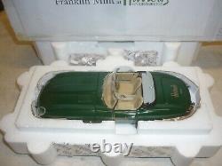 A Franklin mint scale model of a 1961 Jaguar E Type / XKE, Roadster, HARRODS