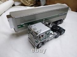 A Franklin mint scale model of a 1979 FREIGHTLINER truck & trailer