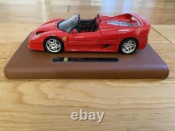 Burago Limited Edition Ferrari F50 model on a tan leather stand in 118 scale