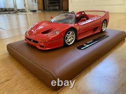 Burago Limited Edition Ferrari F50 model on a tan leather stand in 118 scale