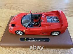 Burago Limited Edition Ferrari F50 model on a tan leather stand in 118 scale