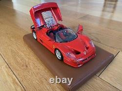 Burago Limited Edition Ferrari F50 model on a tan leather stand in 118 scale