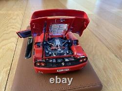 Burago Limited Edition Ferrari F50 model on a tan leather stand in 118 scale