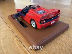 Burago Limited Edition Ferrari F50 model on a tan leather stand in 118 scale